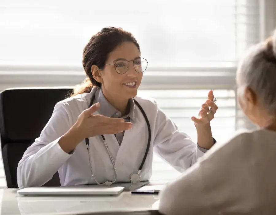 Nurse Practitioner Discussing Treatment Options with Adult Patient